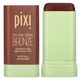 Swatch of Pixi On-the-Glow Bronze on various skin tones, demonstrating blendable creamy texture