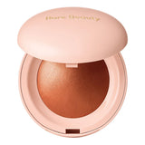 Rare Beauty Positive Light Silky Touch Highlighter Reveal swatch showing champagne shimmer on skin