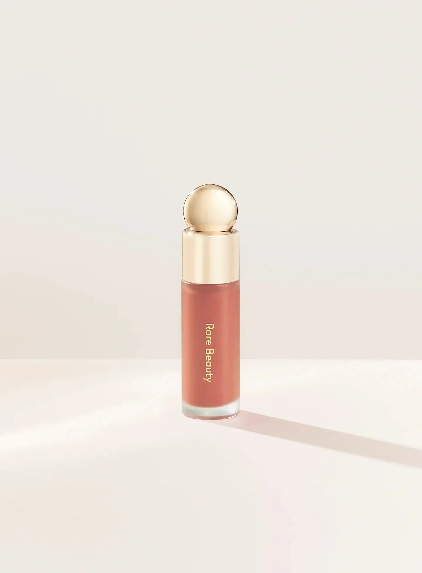 Rare Beauty Soft Pinch Liquid Blush in shade Virtue beige peach dewy finish product bottle