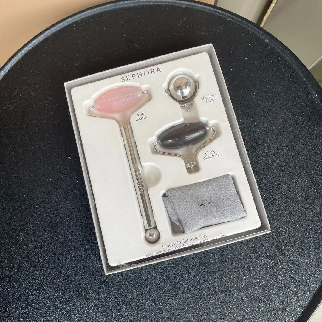 Sephora Deluxe Facial Roller Set with rose quartz and black obsidian stones in a pink storage pouch