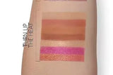 Close-up of Sephora Heat palette eyeshadows showing rich texture and pigmentation of coral shimmer and matte brown