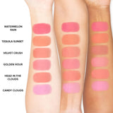 Too Faced Cloud Crush Blush Tequila Sunset swatch on arm showing warm peach shade