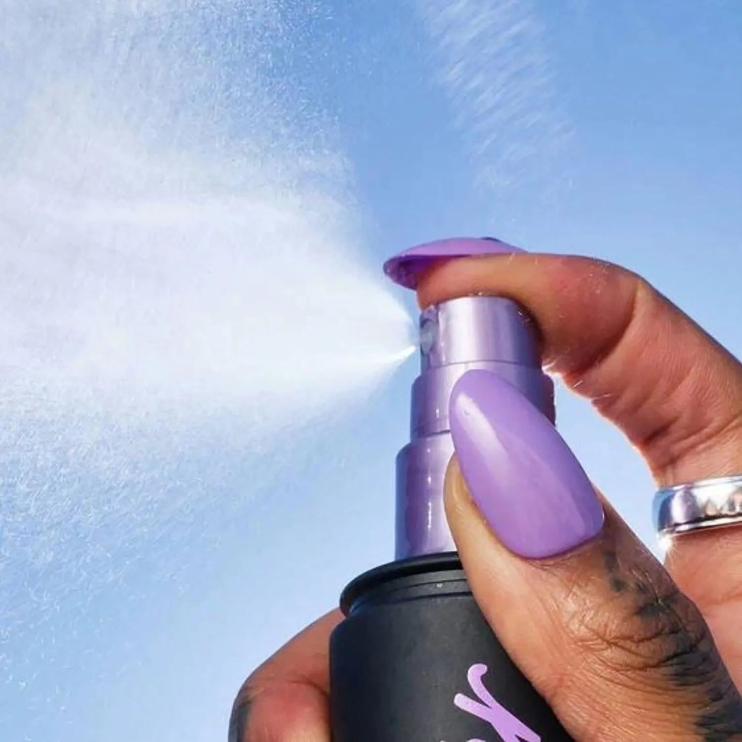 Urban Decay All Nighter Setting Spray 30ml being applied on face with microfine mist