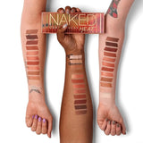 Urban Decay Naked Heat palette opened to reveal mirror and double-ended brush