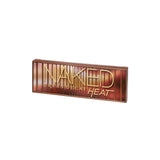 Urban Decay Naked Heat eyeshadow palette angled view showing shade names and textures